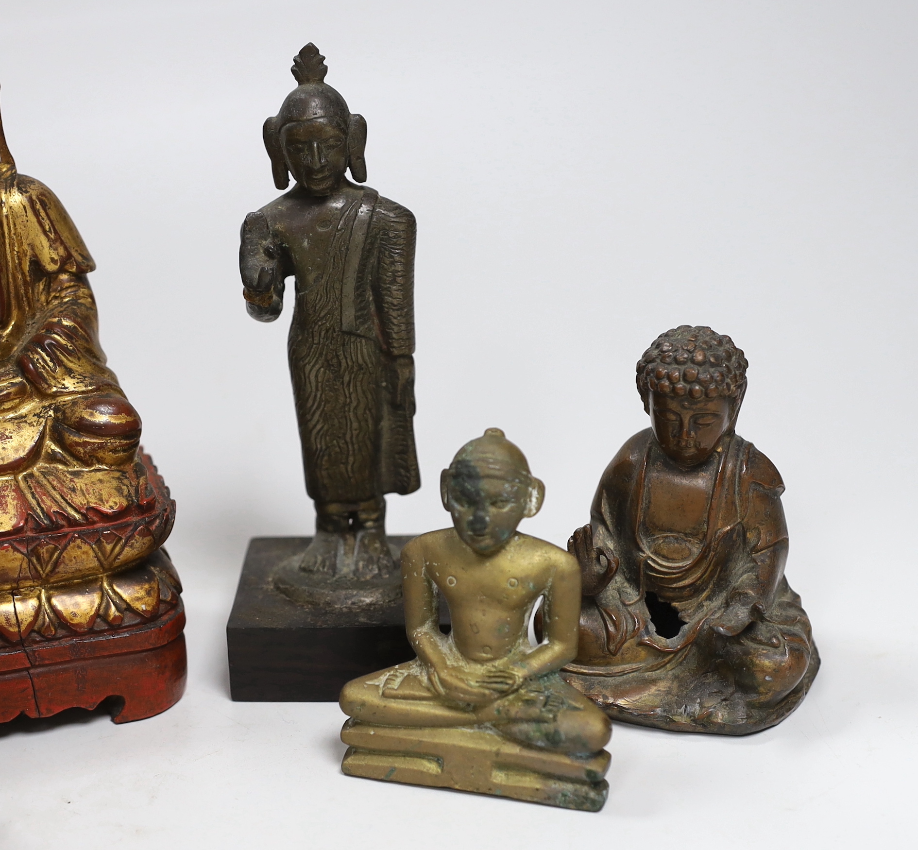 A group of Burmese, Chinese and Indian figures of deities, tallest 14.8cm (8)